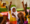 A close up of a smiling young pupil with her hand raised in a classroom