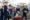 A group of young pupils wearing hard hats playing at constructing with foam blocks